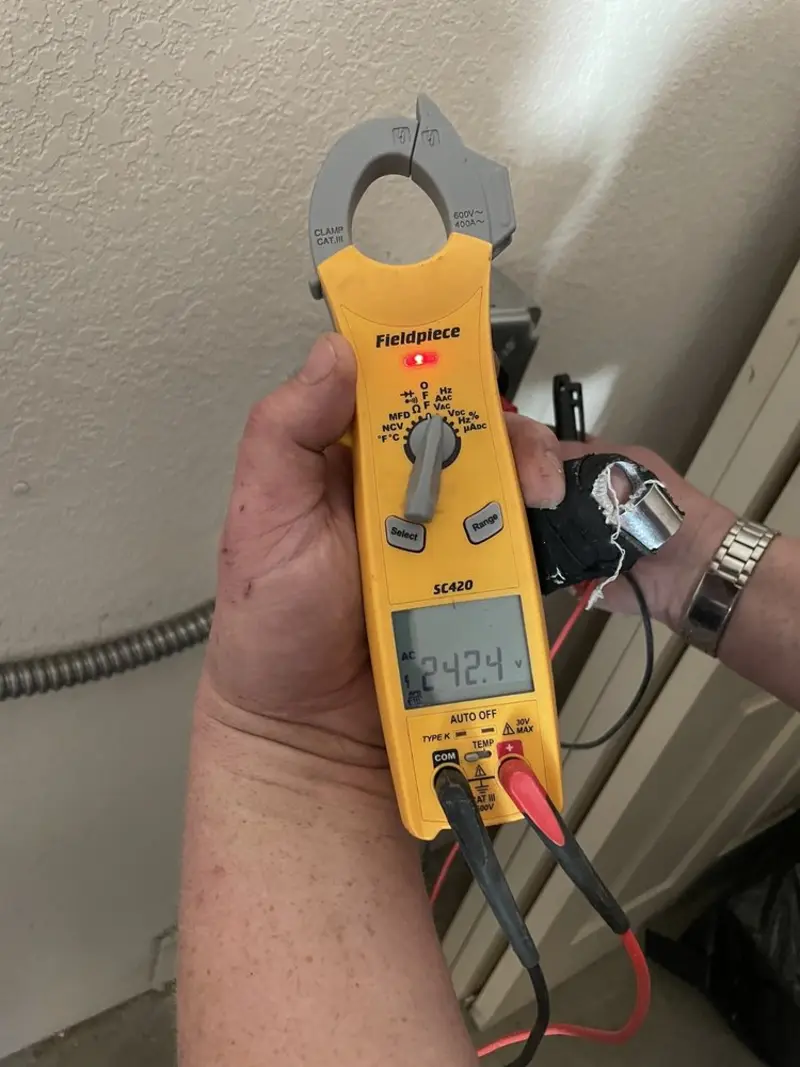 Voltage testing with clamp meter during Electrical Installation Services in Riverview
